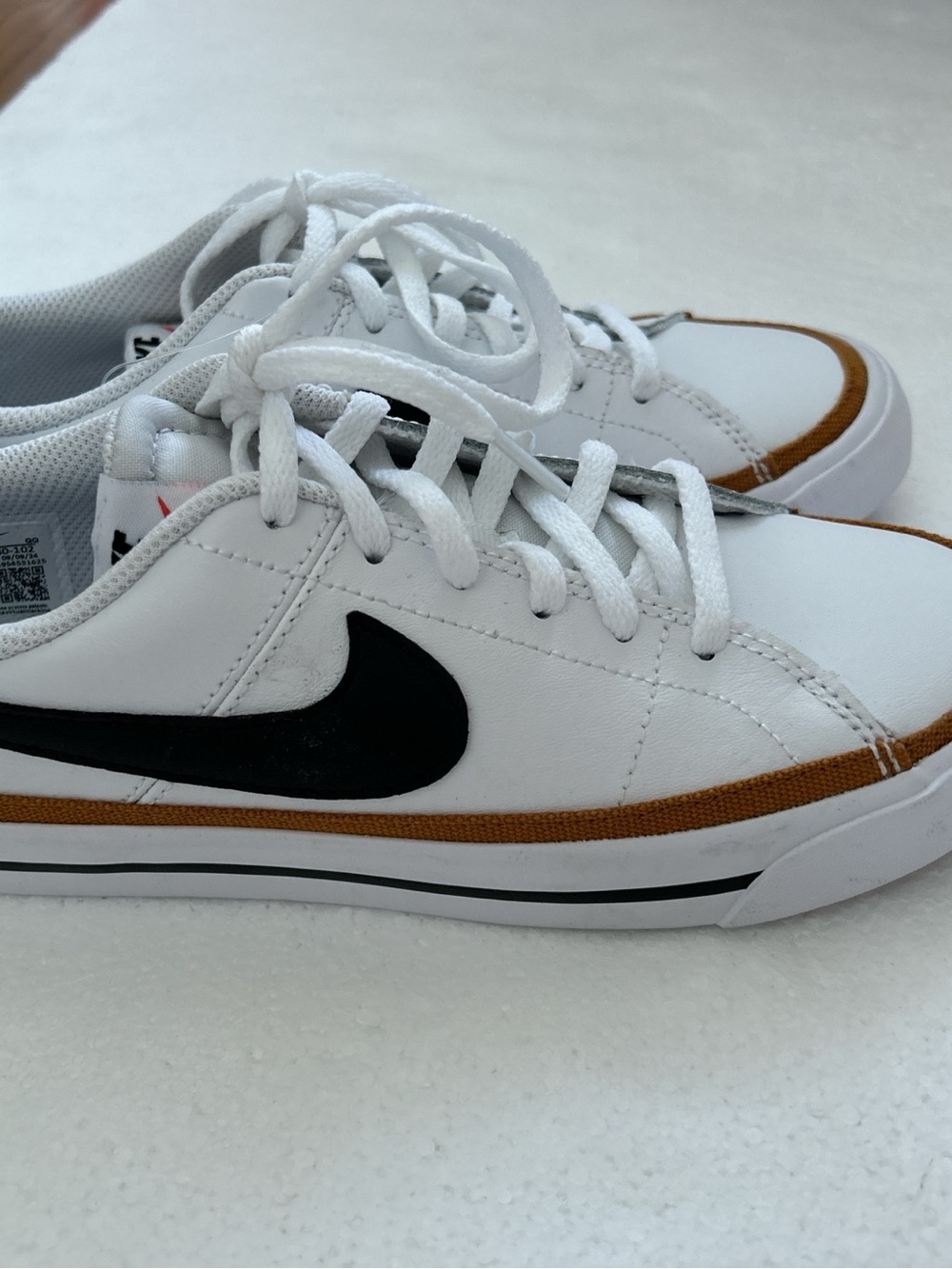 Nike Court Legacy white sneakers with black Nike swoosh and brown trim #court #l